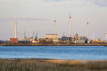 Harbor Industry And Wind Turbines In Evening Sunlight - 90758658