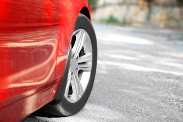 Wheel of red car, outdoors