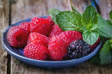 Plate of raspberries and blackberries