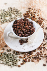 Green, brown and black coffee beans