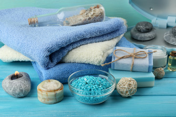 Obraz na płótnie Canvas Spa stones and spa treatments on color wooden background