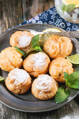 Cakes profiteroles with lemonade