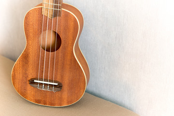 Fototapeta premium Close up of ukulele with soft light, Vintage tone