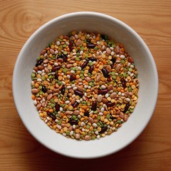 White Bowl with Various Kind of Legumes on Wooden Desk