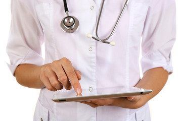 Female doctor working on digital tablet