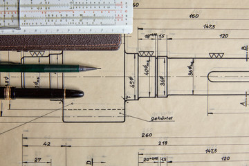 Old technical plan with pen on old table - 90762096