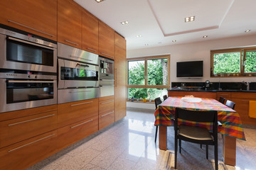 Interior, wide domestic kitchen
