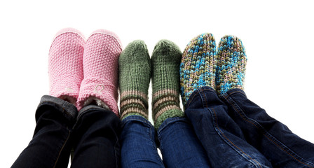 Human feet in knitted socks isolated on white