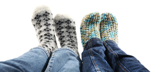 Human feet in knitted socks isolated on white