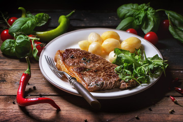 Grilled steak with potatoes