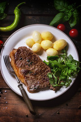 Grilled steak with potatoes