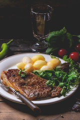 Grilled steak with potatoes