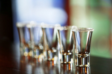 Empty shot glasses on bar counter