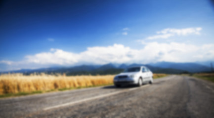 Blurred background with car on road