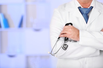 Doctor with stethoscope at his workplace