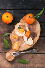 Tangerines on cutting board