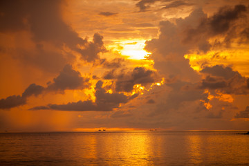 Obraz na płótnie Canvas Silhouetted the beach at the sunset time.