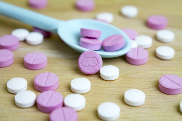 group of drugs on a spoon and wooden board
