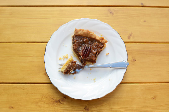 Half-eaten Slice Of Pecan Pie