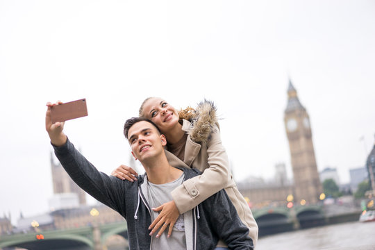 Tourist Couple taking selfie at Big Ben, London
