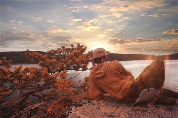 Tourists rest in the autumn at sunset mountains landscape