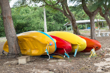 Colorful kayaks in stack