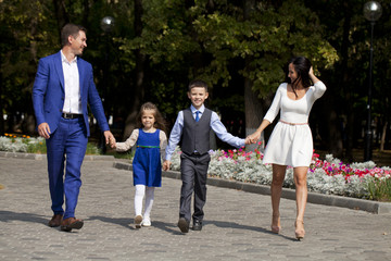 Happy Family Walking Along Suburban Street