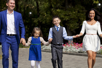 Happy Family Walking Along Suburban Street