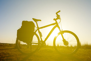 Fototapeta na wymiar bicycle silhouette on a sunset background
