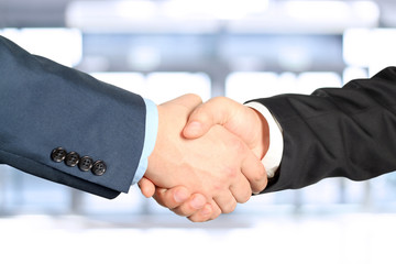 Close-up image of a firm handshake  between two colleagues