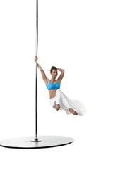 Image of charming female dancer spinning on pole