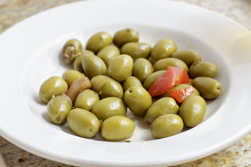 Dish of green olives of sevillian type