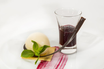 creamy dessert is decorated with blackberries on a white background