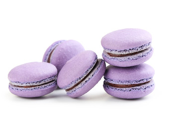 Fototapeta na wymiar Tasty purple macarons isolated on white