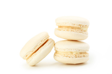 Tasty beige macarons isolated on white