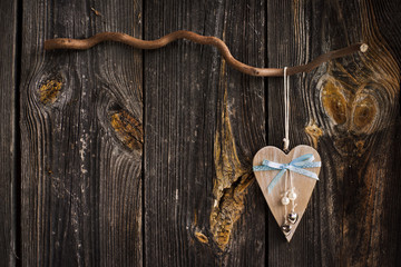 wooden heart hanging on a branch