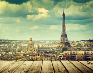Wall murals Paris background with wooden deck table and Eiffel tower in Paris