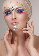 Model with makeup and jewelry, rhinestones
