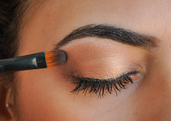 woman applying makeup eyeshadow