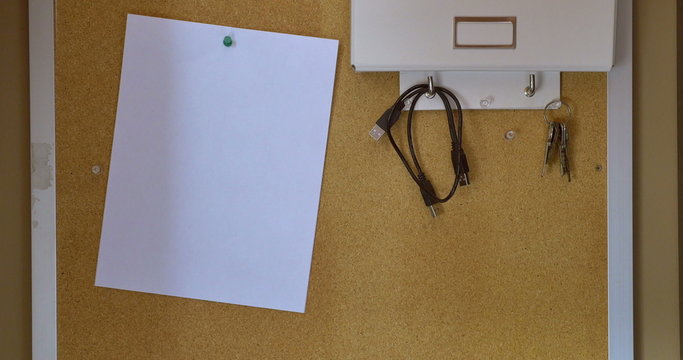 4K Putting Up a Blank Paper on a Bulletin Board