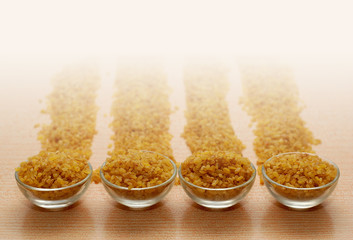 Small Glass Bowls with Bulgur in Rows
