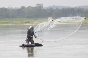 throwing fishing net during