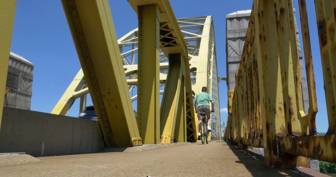 4K Man Rides Bike On West End Bridge