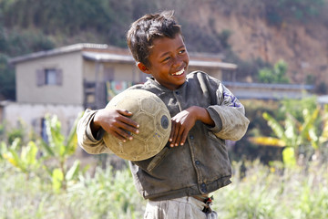 Poverty - Malagasy Boy Hand Holding Soccer Ball