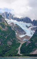 Glacier flowing down at mountain
