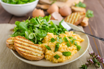 Scrambled eggs with salad