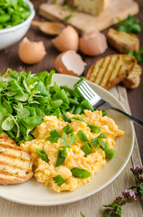 Scrambled eggs with salad