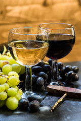 white and red wine with fresh grapes