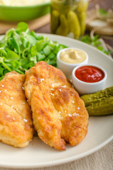 Schnitzel with mashed potatoes and salad