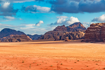 Wadi Rum desert and mountains in southern Jordan 60 km to the east of Aqaba. Wadi Rum has led to its designation as a UNESCO World Heritage Site and is known as The Valley of the Moon.